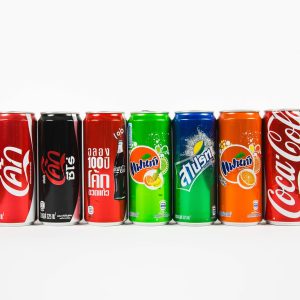 seven assorted-brand soda cans